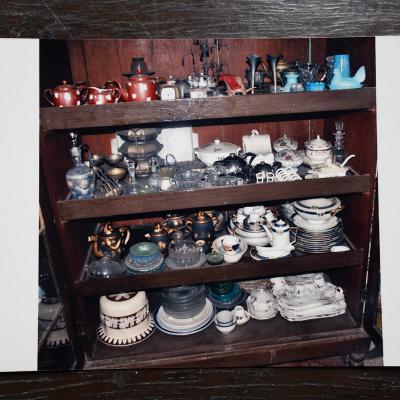 Photograph Of Preserved Crockeries In The Shelf